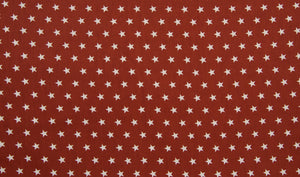 Baumwollstoff Sterne rot terracotta